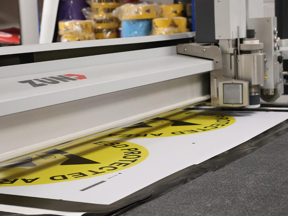 ESD Floor Sign Being Cut by Custom Shape Die Cutting Machine 1