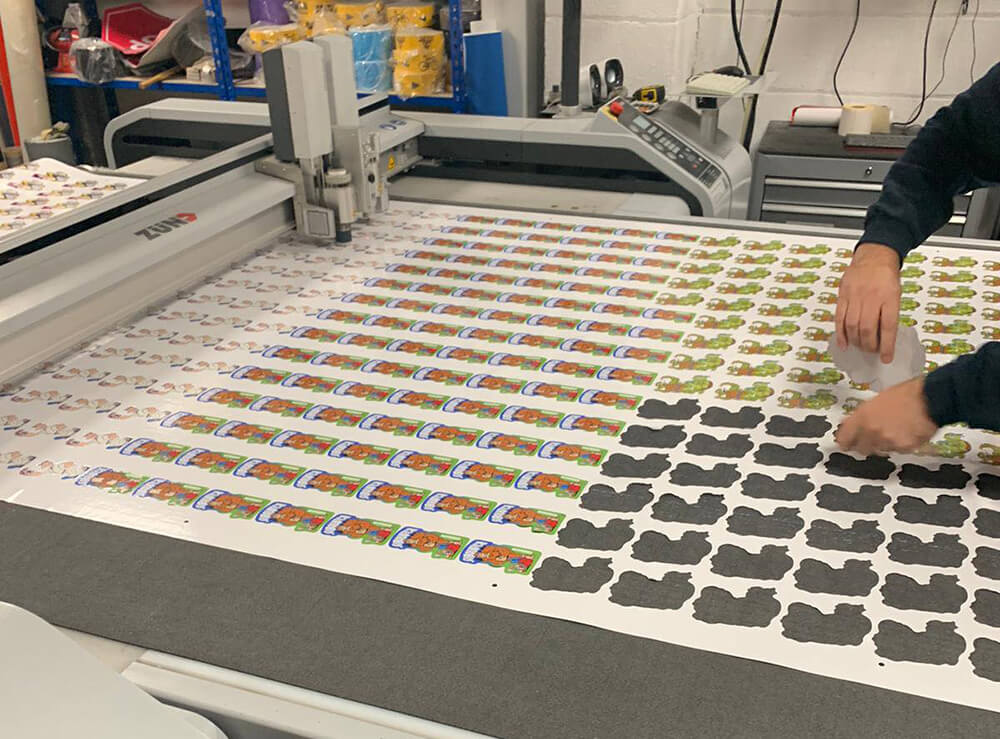Small Custom Printed Stickers Being Cut on Digital Cutting Machine 2
